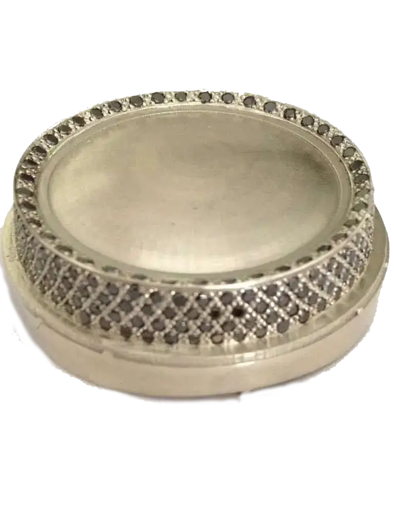 Black diamond grain setting on silverware showing traditional technique