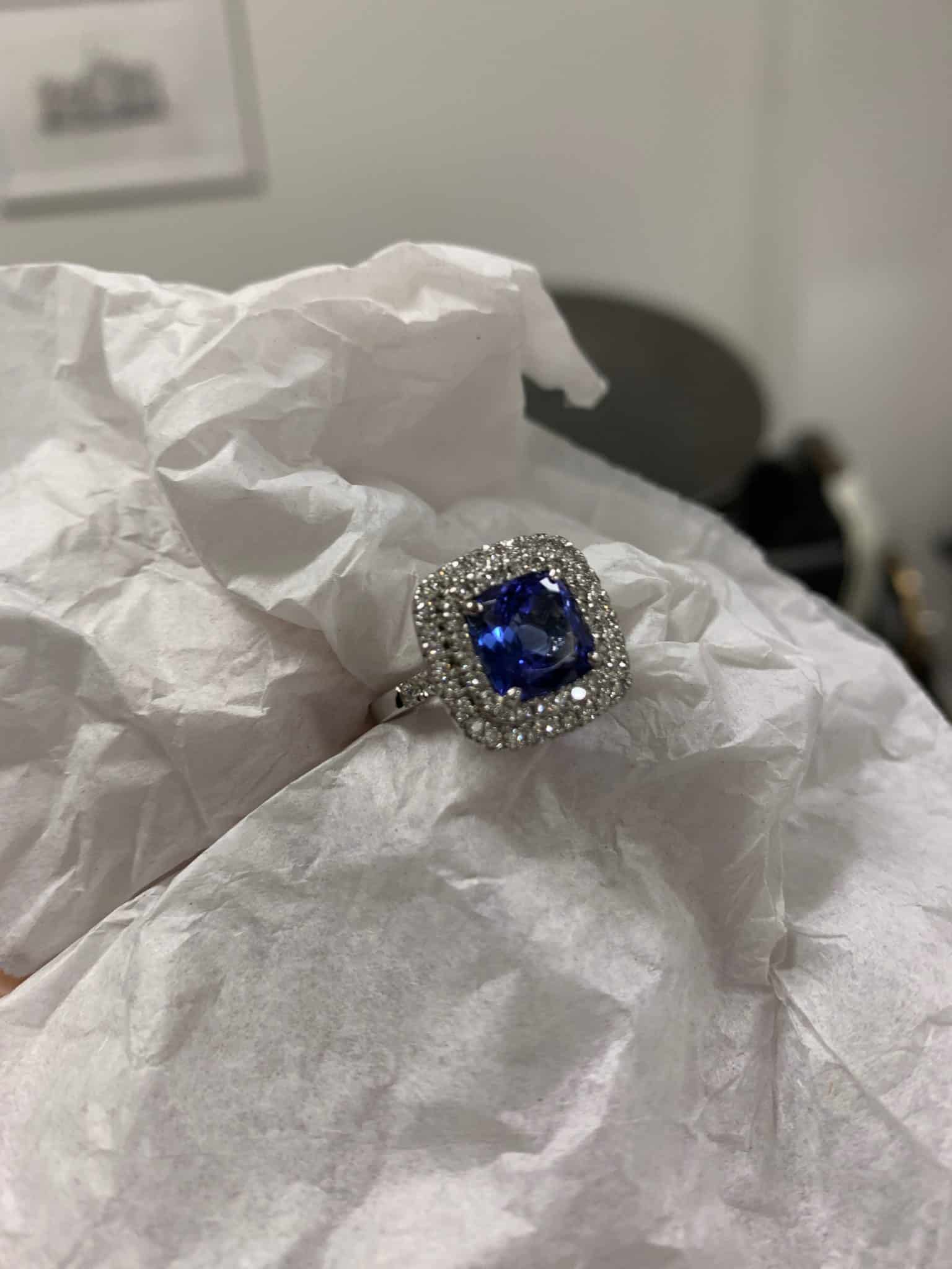 Cushion cut tanzanite double halo ring completed setting