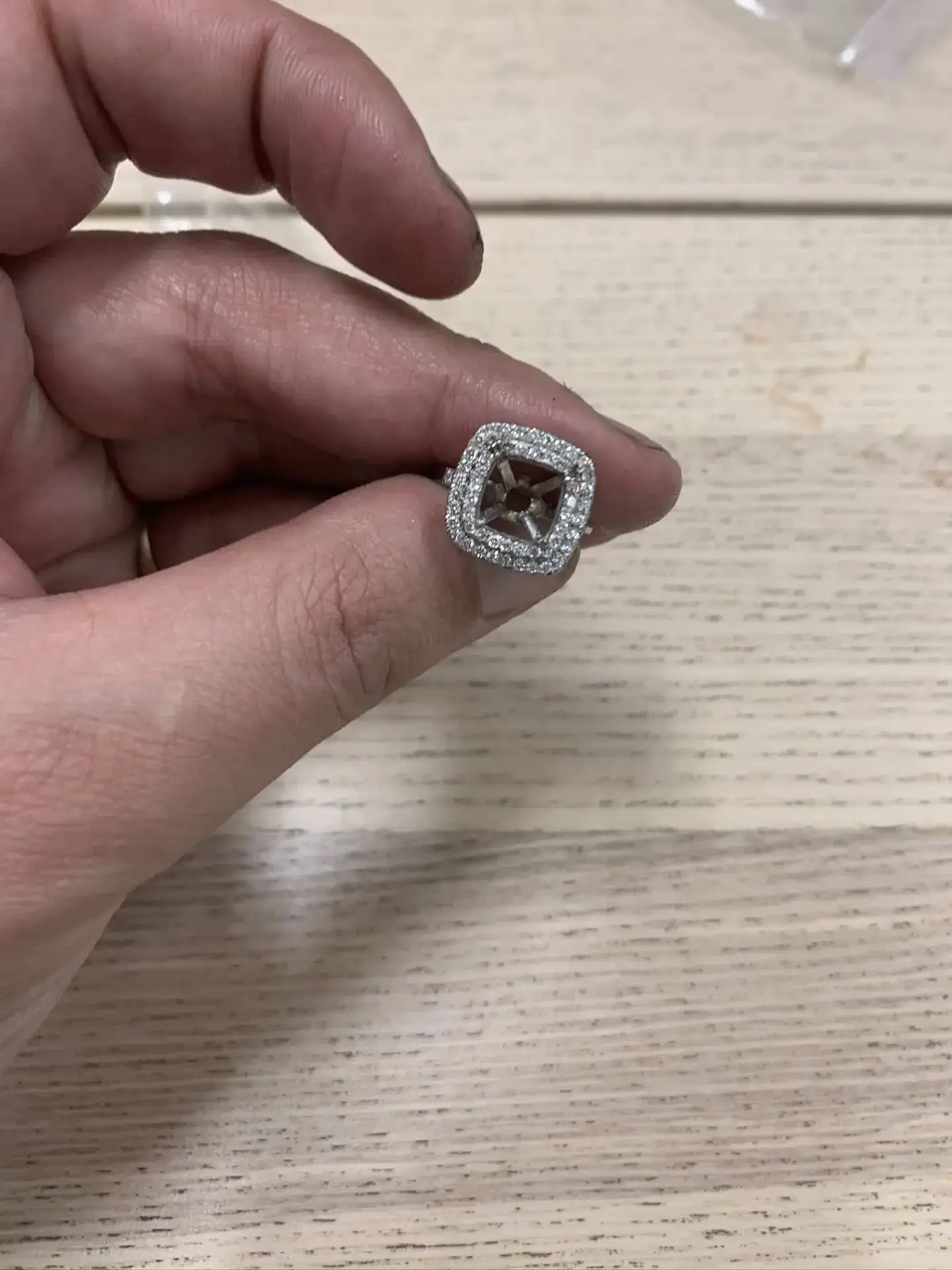 Cushion tanzanite platinum ring prepared for stone setting before completion