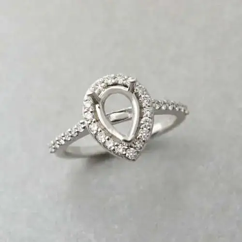 Pear shaped sapphire halo ring mount in white gold ready for setting