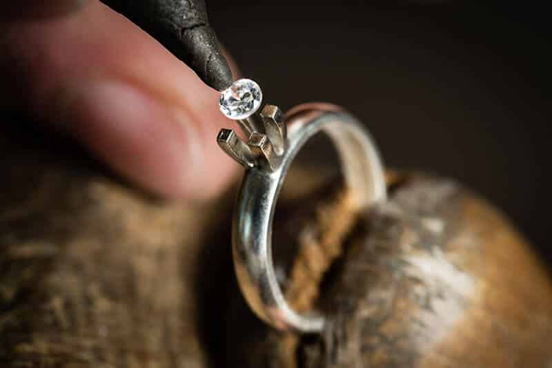 Platinum solitaire engagement ring with four prong diamond setting
